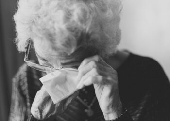 woman wiping her eyes